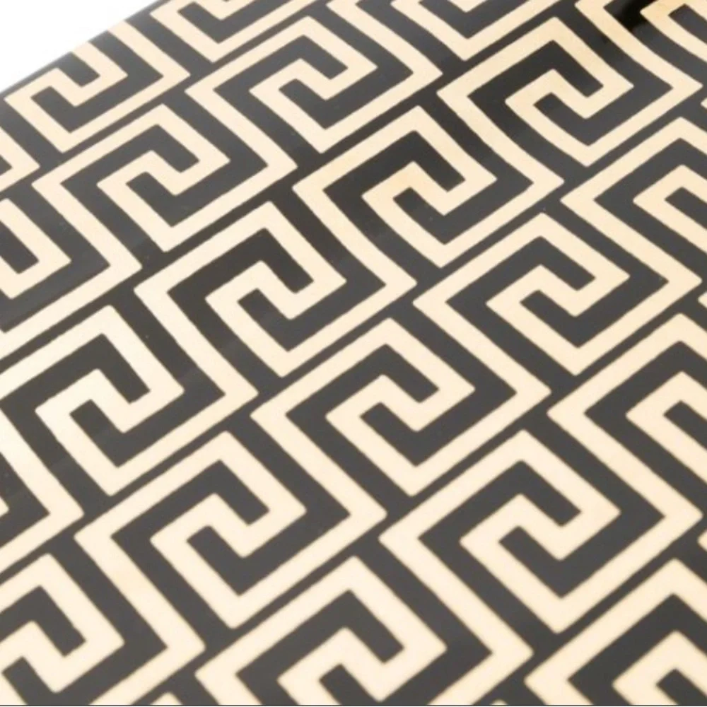 Fornasetti-inspired geometric print handbag